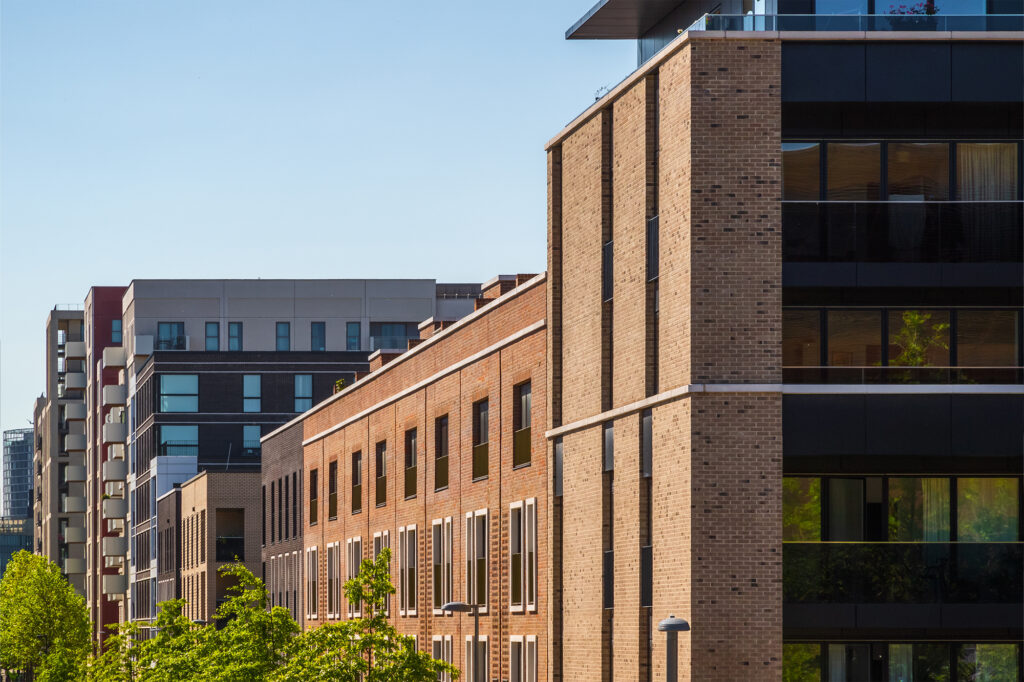 Modern brick and glass apartment blocks of flats